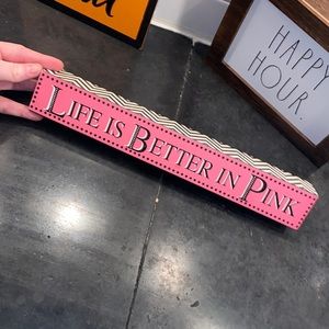 Pink wooden wall sign